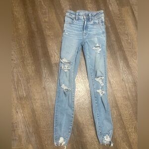 AE distressed super high rise jegging next level stretch 000 GC